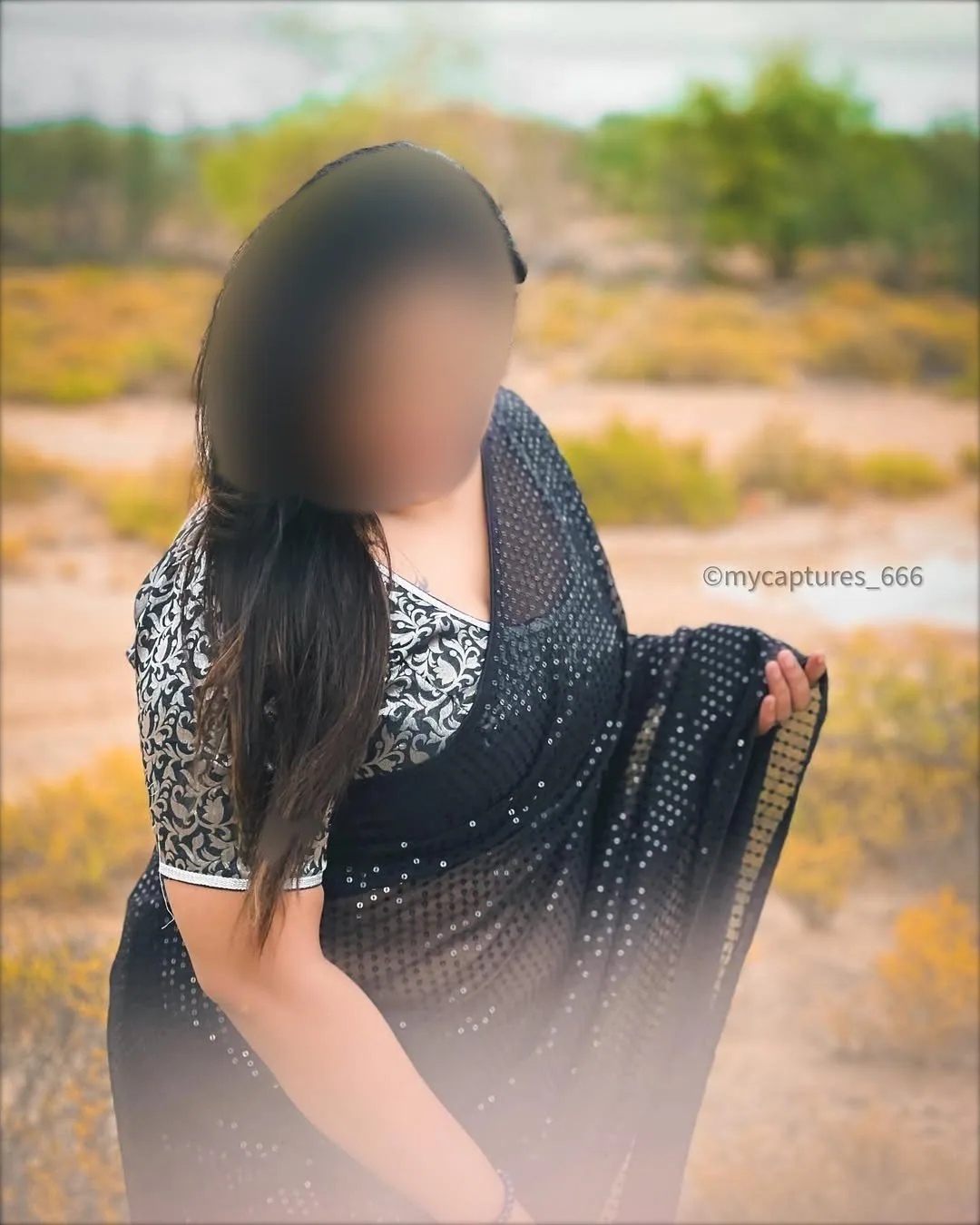 Pranavi confident black saree portrait